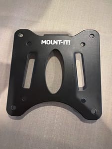 Black metal bracket labeled "MOUNT-IT!" with mounting holes and slots