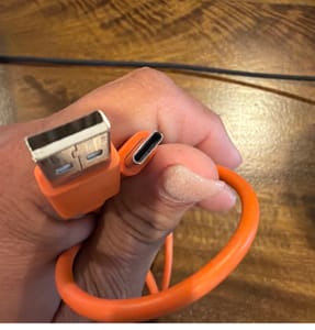 USB-A to USB-C Cable (Orange, Coiled)