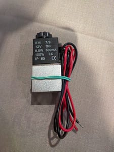 Solenoid coil/valve component: black, labeled "EVI 7/9 DC 12V 6.5W 500mA 100% ED IP 65 CE"